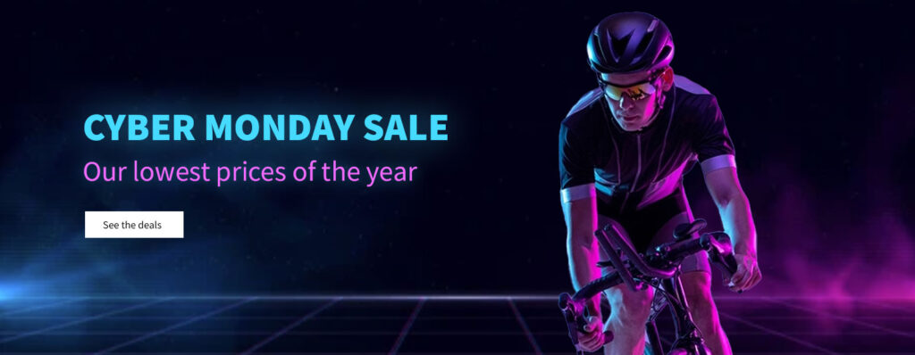 Cyber Monday Sale with a futuristic-looking cyclist lit by blue and purple light