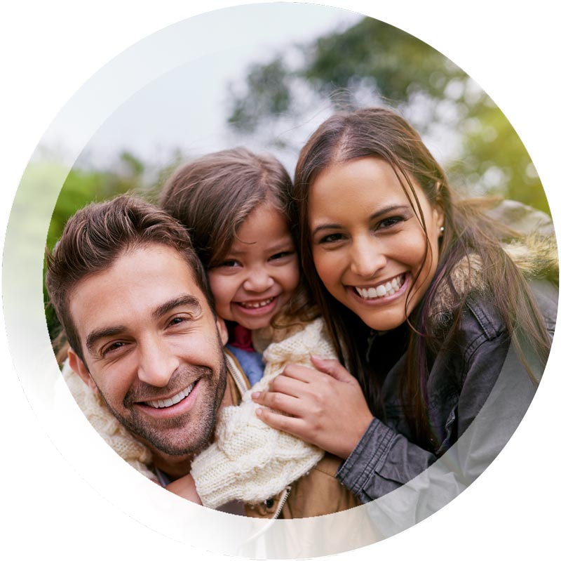 Happy family of three huddled together