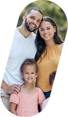 Smiling family with a man, woman, and little girl